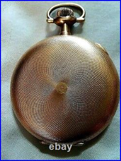 Waltham pocket watch in a Crescent yellow metal case with a white porclain dial